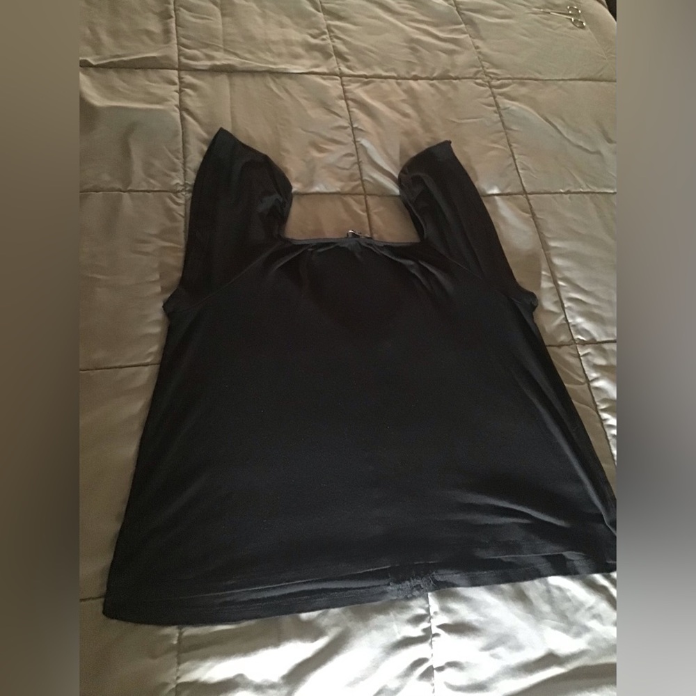 The simple black top you must have! Short sleeve, size Medium
